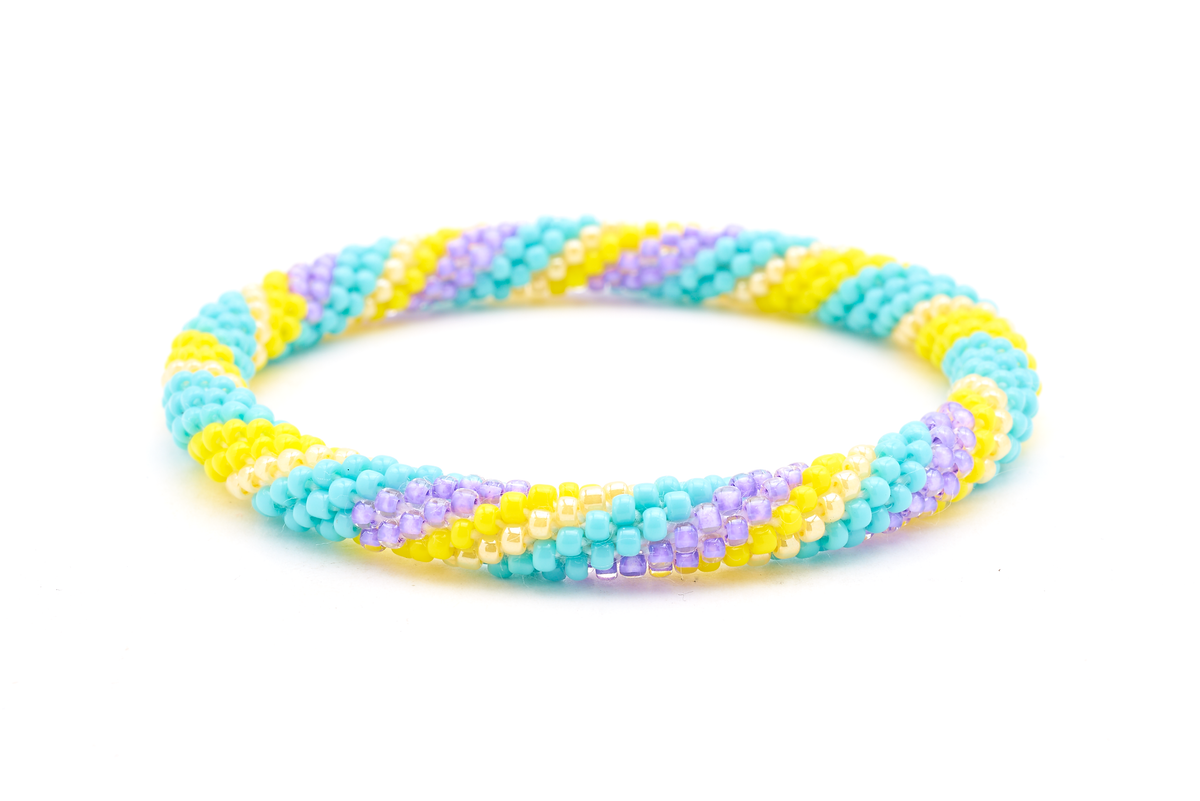 Handmade Beaded friendship bracelet with turquoise, yellow, and purple glass beads. Crafted by artisans in Nepal for Sashka Co. 