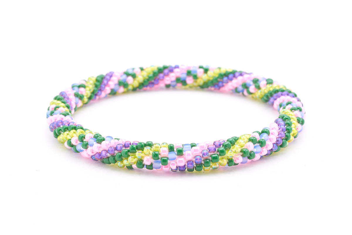 Handmade beaded friendship bracelet with green, light green, pink, light blue, and purple glass beads. Crafted by artisans in Nepal for Sashka Co.