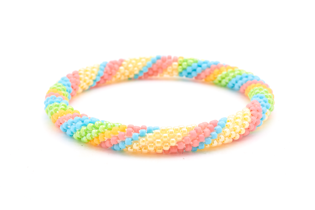 Handmade beaded friendship bracelet with matte coral, turquoise, green, matte yellow, and cream glass beads. Crafted by artisans in Nepal for Sashka Co.