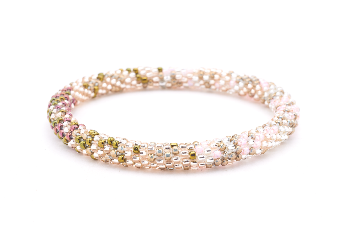Handmade beaded friendship bracelet with plum, rose gold, and iridescent glass beads. Crafted by artisans in Nepal for Sashka Co.