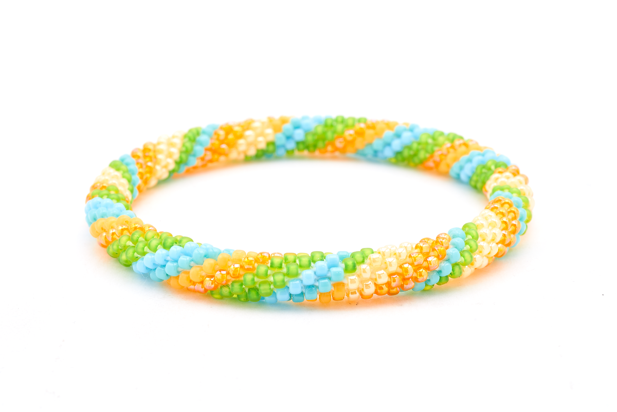 Handmade beaded friendship bracelet with turquoise, matte green, iridescent orange, and yellow glass beads. Crafted by artisans in Nepal for Sashka Co.