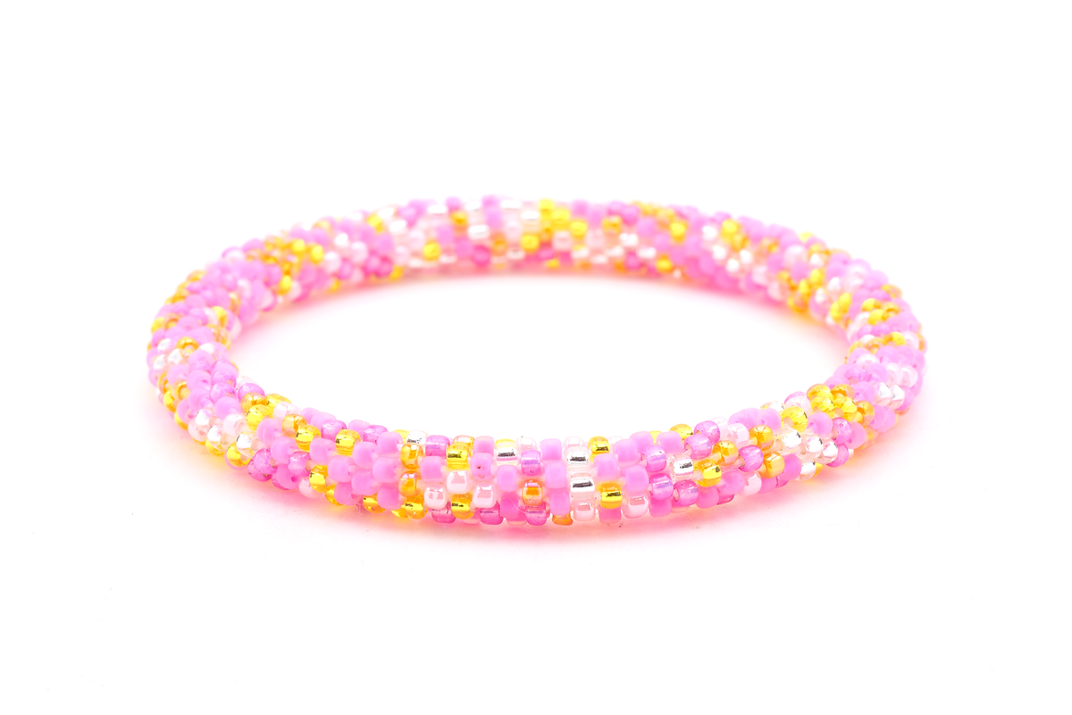 Handmade beaded friendship bracelet with matte pink, pink, yellow, orange, and clear glass beads. Crafted by artisans in Nepal for Sashka Co.
